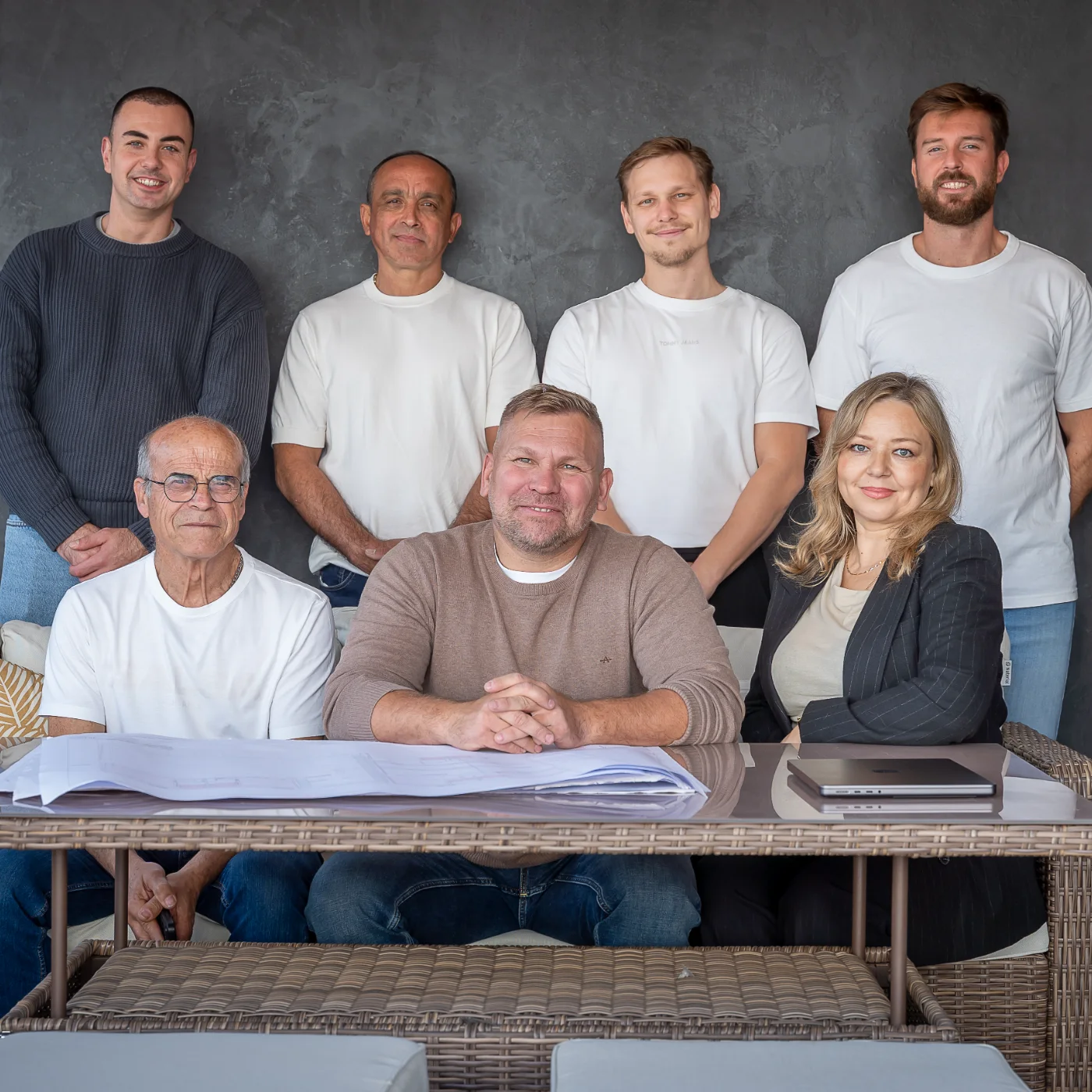 The Realta Constructions team together around a set of plans in Marbella